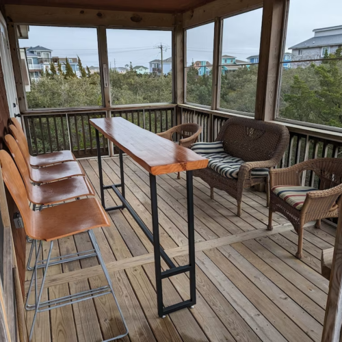 avon outer banks beach vacation rental patio with a table and chairs